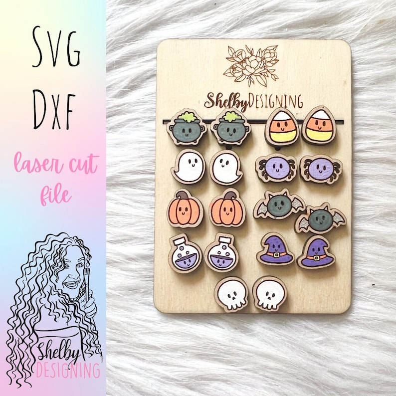 May include: A wooden sheet with 12 different Halloween-themed laser cut designs. The designs include a cauldron, ghost, spider, pumpkin, potion bottle, witch hat, and skull. The sheet is labeled "Shelby DESIGNING".