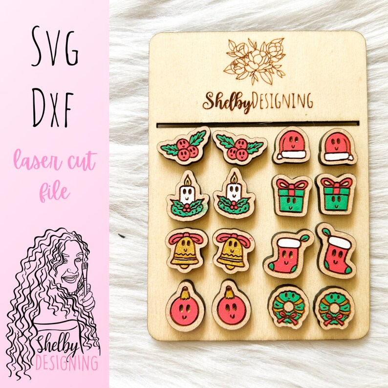 May include: A sheet of wood with 12 laser cut Christmas ornaments. The ornaments are in pairs and include a candle, a bell, a stocking, a gift box, a wreath, a Christmas tree, and an ornament. The ornaments are painted in red, green, yellow, and white.
