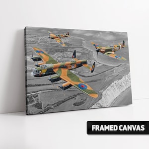 May include: A framed canvas print of a black and white illustration of three airplanes flying in formation. The planes are a green and orange bomber, a green and orange fighter plane, and a green and orange fighter plane. The bomber has the word "IRON" written on it. The planes are flying over a landscape with hills and a river.