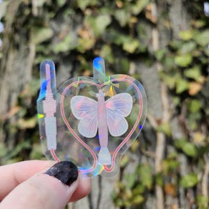 Pegatina de aguja con mariposa rosa