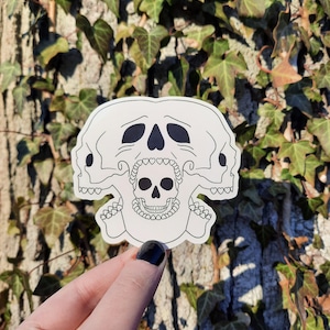 Pegatina de vinilo con calaveras gritando