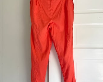 Vintage 1980s high waisted linen pants in bright salmon orange