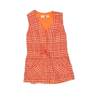 May include: A sleeveless orange and white plaid dress with a button-up front and a tie at the waist.