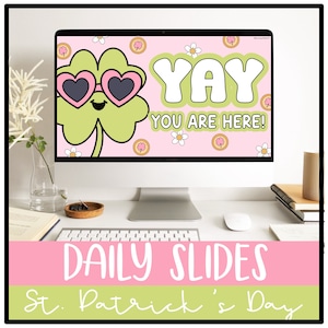以下が含まれることがあります： ピンクとグリーンのセントパトリックデーをテーマにした毎日のスライドテンプレートが表示されたコンピューター画面。画面には、サングラスをかけた漫画のクローバーと「Yay You Are Here！」というテキストが表示されています。