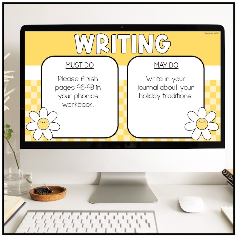 May include: A computer screen displaying a yellow and white writing assignment for students. The screen shows two sections, "Must Do" and "May Do". The "Must Do" section instructs students to finish pages 96-98 in their phonics workbook. The "May Do" section instructs students to write in their journal about their holiday traditions.