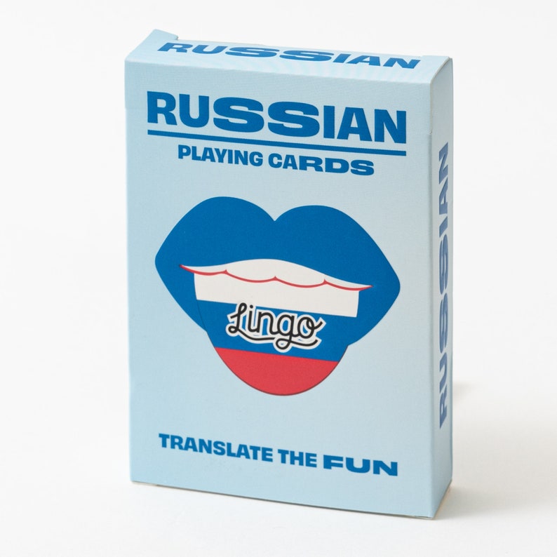 May include: A light blue deck of Russian Playing Cards in a rectangular box. The front features a graphic of blue, white, and red lips with the word Lingo in black script. The text RUSSIAN PLAYING CARDS and TRANSLATE THE FUN are printed in blue.