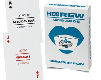 May include: A deck of Hebrew playing cards in a white box with blue text and a blue lip graphic featuring a Star of David. Two cards are displayed: an Ace of Spades with the text AL LO DAVAR and a Jack of Diamonds with the text YALLA!