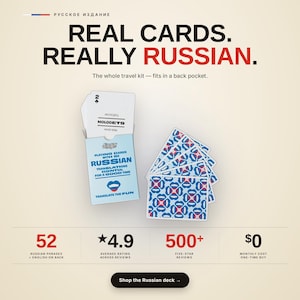 May include: A deck of playing cards with a light blue box featuring the text Lingo Playing Cards with 52 Russian translations essential for a good time. The cards display Russian phrases like Molodets and have a blue, red, and white patterned back.