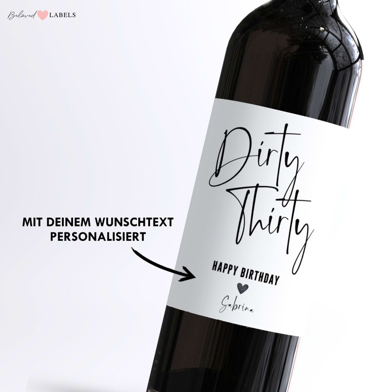 May include: A white wine bottle label with black text that reads "Dirty Thirty Happy Birthday" with a small heart symbol and the name "Sabrina".