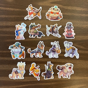 May include: A set of 12 colorful stickers featuring various dog breeds in different poses and outfits. The stickers are printed on a white background and have a glossy finish.