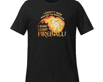 May include: Dark gray t-shirt with the text "I DIDN'T ASK HOW BIG THE ROOM WAS, I SAID I CAST FIREBALL!" in orange and white. The graphic features a flaming fireball with a die inside.
