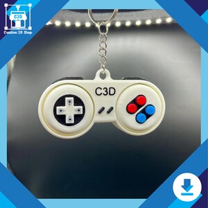 Retro controller fidget toy made from STL file shown on keyring