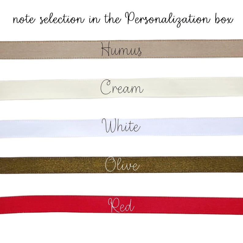 May include: A selection of satin ribbons in various colors, including Humus, Cream, White, Olive, and Red. The text "note selection in the Personalization box" is at the top. Each ribbon is labeled with its color name in a cursive font.