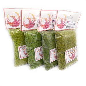 May include: Four packs of green static grass, each labelled "Phoenix Games Studio" and "Static Grass 3mm 30g".