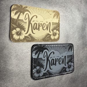 May include: Two rectangular patches with the name "Karen" in a script font. One patch is tan with a tropical sunset design and the other is gray with a similar design. Both patches feature palm trees and hibiscus flowers.