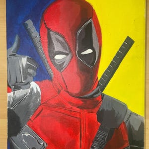 May include: A hand-painted canvas featuring a portrait of Deadpool, a fictional superhero known for his red and black suit, with a yellow background and a blue section in the top left corner.