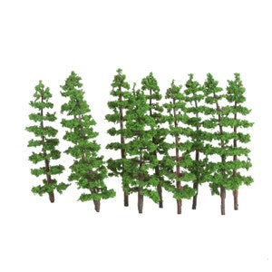 May include: A set of ten green plastic model trees for use in model railroading or other miniature scenes.