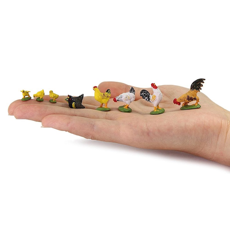 May include: A set of miniature farm animal figurines, including a rooster, hen, and chicks. The figurines are made of plastic and are painted in realistic colours. The figurines are arranged on a hand, with the rooster at the front and the chicks at the back.