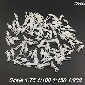 May include: A collection of 100 small, white plastic figures in various poses, including standing, sitting, and lying down. The figures are intended for architectural models, with scale options of 1:75, 1:100, 1:150, and 1:200.