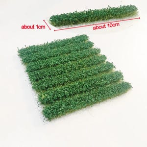 Puede incluir: Tufos de hierba verde para maquetas de trenes, de aproximadamente 1 cm de ancho y 10 cm de largo.