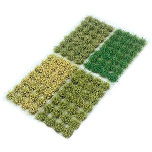 Könnte beinhalten: Eine Platte mit grünen, gelben und hellgrünen Büscheln aus künstlichem Gras für den Modellbau oder die Miniatur-Landschaftsgestaltung.