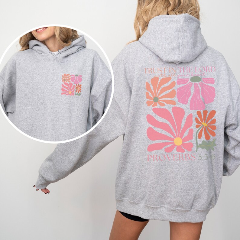 May include: Grey hooded sweatshirt with a floral design and the text "TRUST IN THE LORD WITH ALL YOUR HEART" and "PROVERBS 3:5-6" on the back.