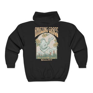 May include: Black hooded sweatshirt with a graphic on the back featuring a frog playing a guitar. The graphic includes the words "AMAZING GRACE" and "how sweet the sound" with the Bible verse Ephesians 2:8-9.