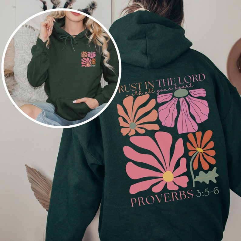 May include: A dark green hoodie with a floral design and the text "TRUST IN THE LORD with all your heart" and "PROVERBS 3:5-6".