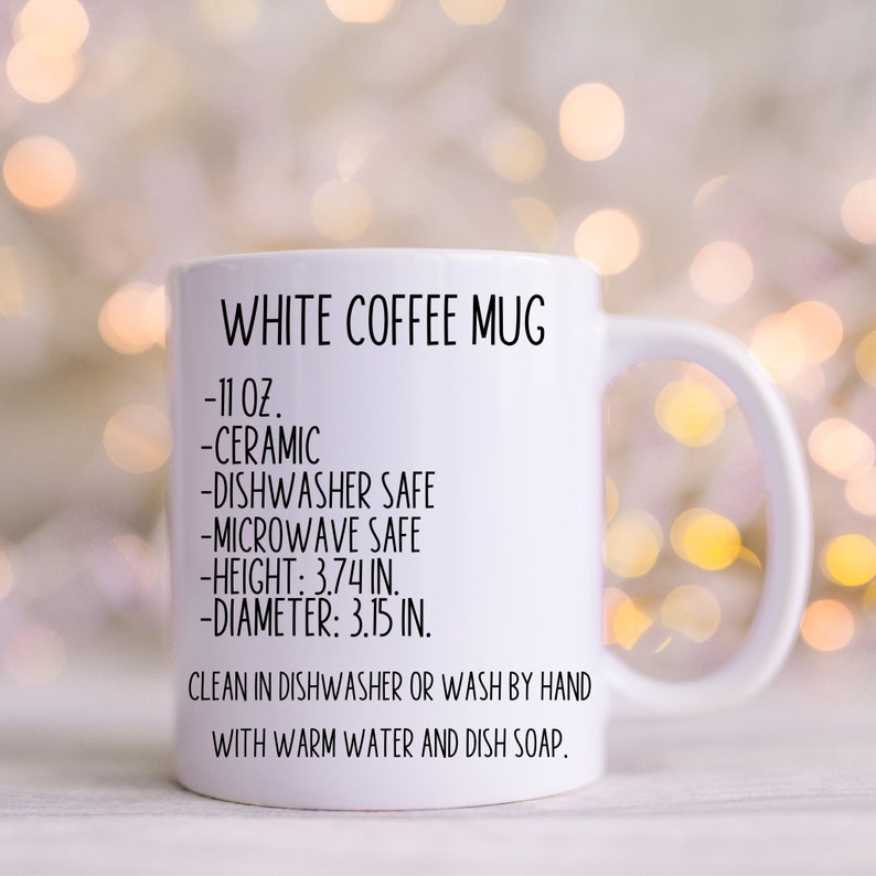 May include: White ceramic coffee mug with black text that reads "WHITE COFFEE MUG", "11 oz", "CERAMIC", "DISHWASHER SAFE", "MICROWAVE SAFE", "HEIGHT: 3.74 IN.", "DIAMETER: 3.15 IN.", "CLEAN IN DISHWASHER OR WASH BY HAND WITH WARM WATER AND DISH SOAP."