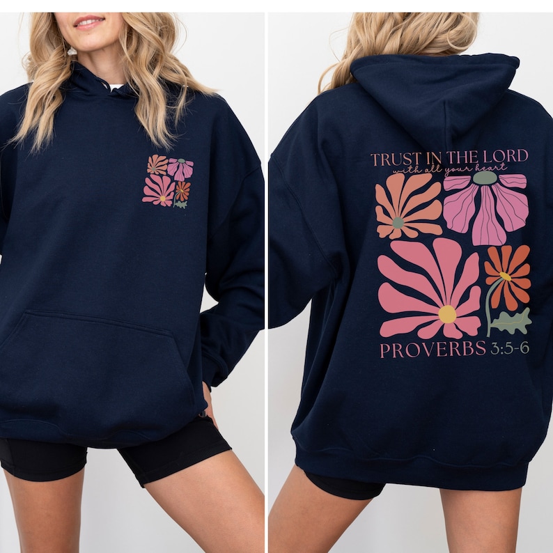 May include: Navy blue hoodie with a floral design and the text "TRUST IN THE LORD with all your heart" and "PROVERBS 3:5-6" on the back.