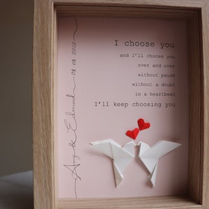 May include: A framed print with a pink background and white origami birds. The print features the text "I choose you and I'll choose you over and over without pause without a doubt in a heartbeat I'll keep choosing you". The date "08:08:2020" and the names "Amy & Edmund" are written in cursive at the top and bottom of the print.