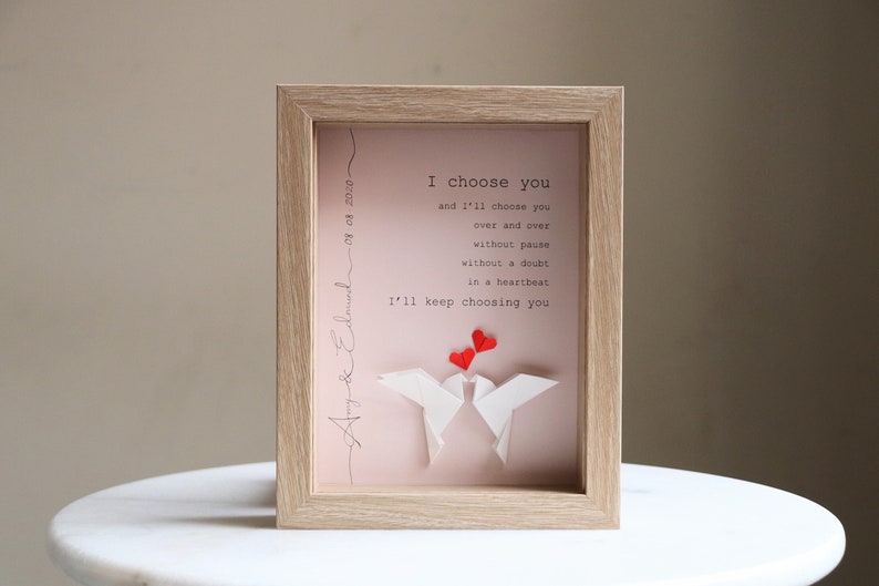 May include: A framed print with a pink background and white origami birds. The print features the text "I choose you and I'll choose you over and over without pause without a doubt in a heartbeat I'll keep choosing you".