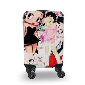 May include: A rolling suitcase with a vibrant cartoon design. The suitcase is decorated with images of a cartoon character in different outfits, alongside a white dog and other graphics. It has black wheels and a black handle.