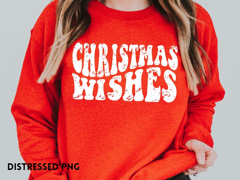 May include: Red sweatshirt with white text that reads "Christmas Wishes" in a distressed font.
