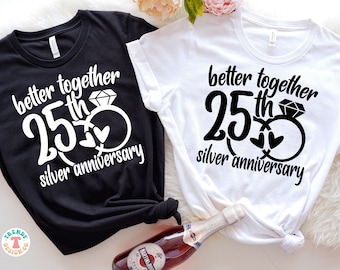 May include: Two black and white t-shirts with the text "better together 25th silver anniversary" and a graphic of two intertwined rings with a diamond on one ring.