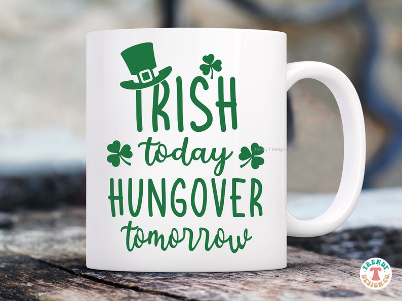 May include: White ceramic mug with a green shamrock design and the text "Irish today, hungover tomorrow".