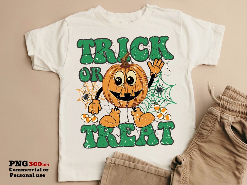May include: White t-shirt with a green "Trick or Treat" graphic featuring a smiling pumpkin with candy corn and spiderwebs.