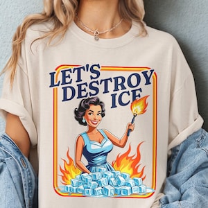 May include: Ivory Comfort Colors t-shirt with the text "LET'S DESTROY ICE" and a retro illustration of a woman holding a torch over ice cubes. The shirt is part of the Mind & Harmony Gifts collection.