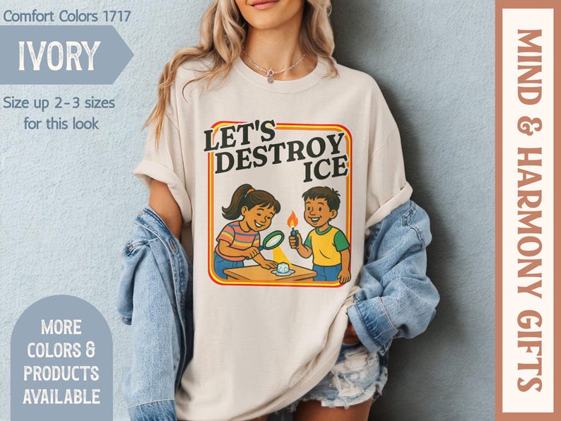 May include: Ivory Comfort Colors t-shirt with the text "LET'S DESTROY ICE" and a graphic of two children experimenting with ice. The shirt has a retro design and is available in multiple colors. The shirt is part of the Mind & Harmony Gifts collection.