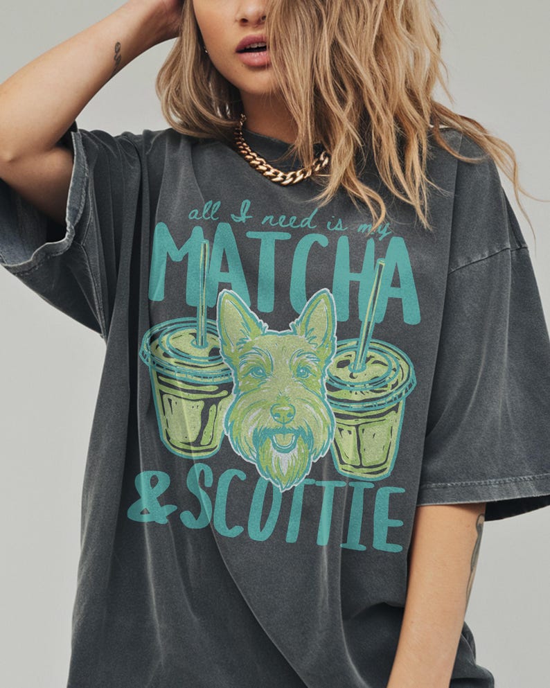May include: Dark gray t-shirt with the text "all I need is my MATCHA & SCOTTIE" in teal. The graphic includes two matcha drinks and a green Scottie dog illustration.