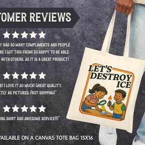 May include: Off-white canvas tote bag with the text "LET'S DESTROY ICE" and an illustration of two children. The bag is held by a person. The bag is 15x16 inches.