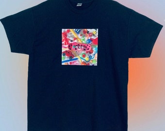 May include: Black t-shirt with a colorful graphic print of a toy game board with the word "GAME" printed on it.