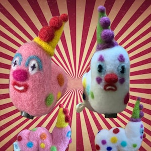 May include: Four felt toy caterpillars with colorful polka dots and clown faces. Each caterpillar has a different colored hat and a different facial expression. The caterpillars are all smiling and have a happy expression.