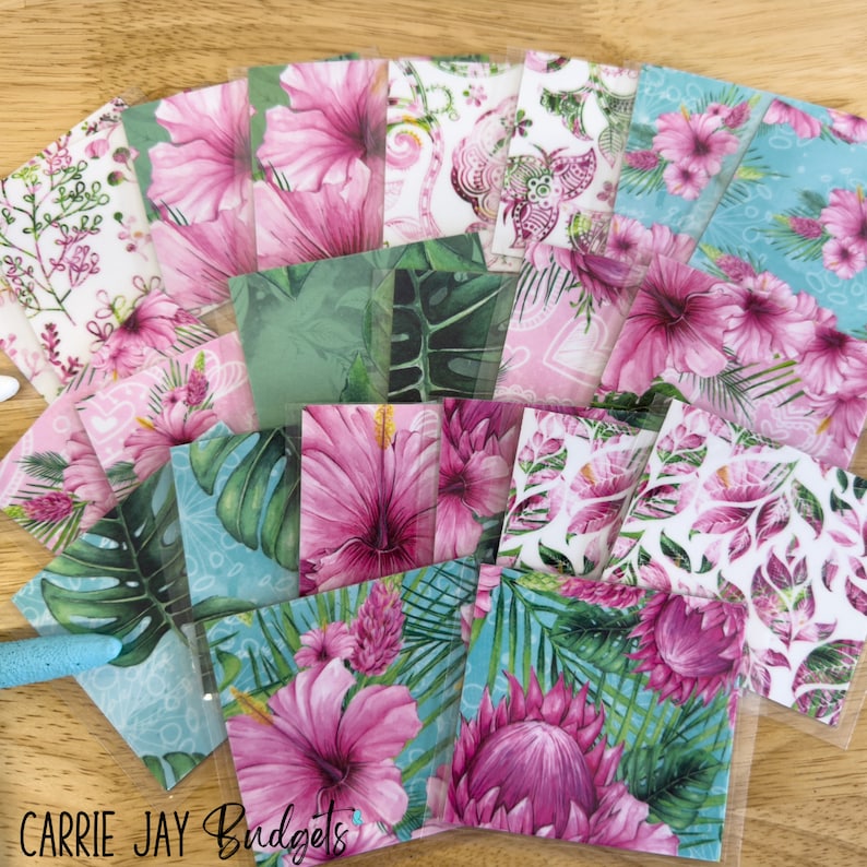 May include: A collection of 12 patterned paper squares featuring tropical floral designs. The papers include pink hibiscus flowers, green leaves, and a blue background. The papers are perfect for scrapbooking, card making, and other craft projects.