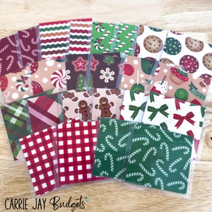 May include: A collection of 20 Christmas themed gift tags with various patterns, including candy canes, gingerbread men, snowflakes, and plaid. The tags are packaged in clear plastic sleeves.