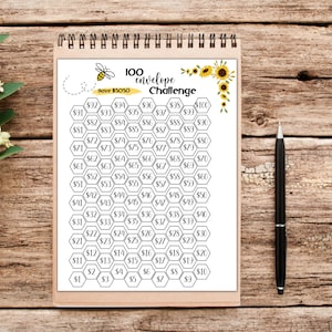May include: A printable 100 envelope challenge savings tracker with a bee and sunflowers. The challenge is to save $5050. The tracker is in the shape of a honeycomb with numbers 1-100 in each cell. Each cell also has a dollar sign and a number representing the amount to save for each envelope.
