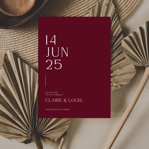 May include: A burgundy save the date card with white text. The date is 14 JUN 25. The text reads "save the date for the wedding of CLAIRE & LOUIS. Formal invitation to follow."