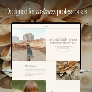 May include: A laptop displaying a website with the text "Designed for wellness professionals" and "A Gentle Guide on Your Journey to Inner Peace." The website features images of a desert landscape and a woman in a dress. The laptop is set against a blurred, neutral-toned background.