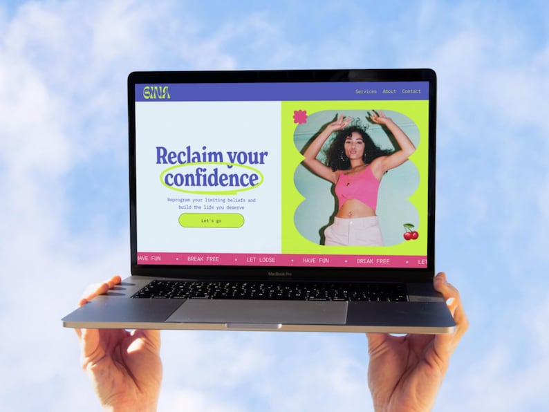 May include: A laptop screen showing a website with the words "Reclaim your confidence." The site features a woman in a pink top and white trousers. The laptop is held against a blue sky.