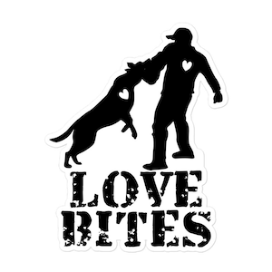 May include: Black and white sticker featuring a silhouette of a person and a dog playing. The dog is jumping up towards the person. Both the dog and person have a heart shape on them. The text "LOVE BITES" is below the figures.